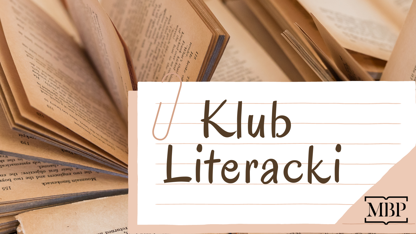 Klub Literacki - napis na kartce, w tle otwarte książki